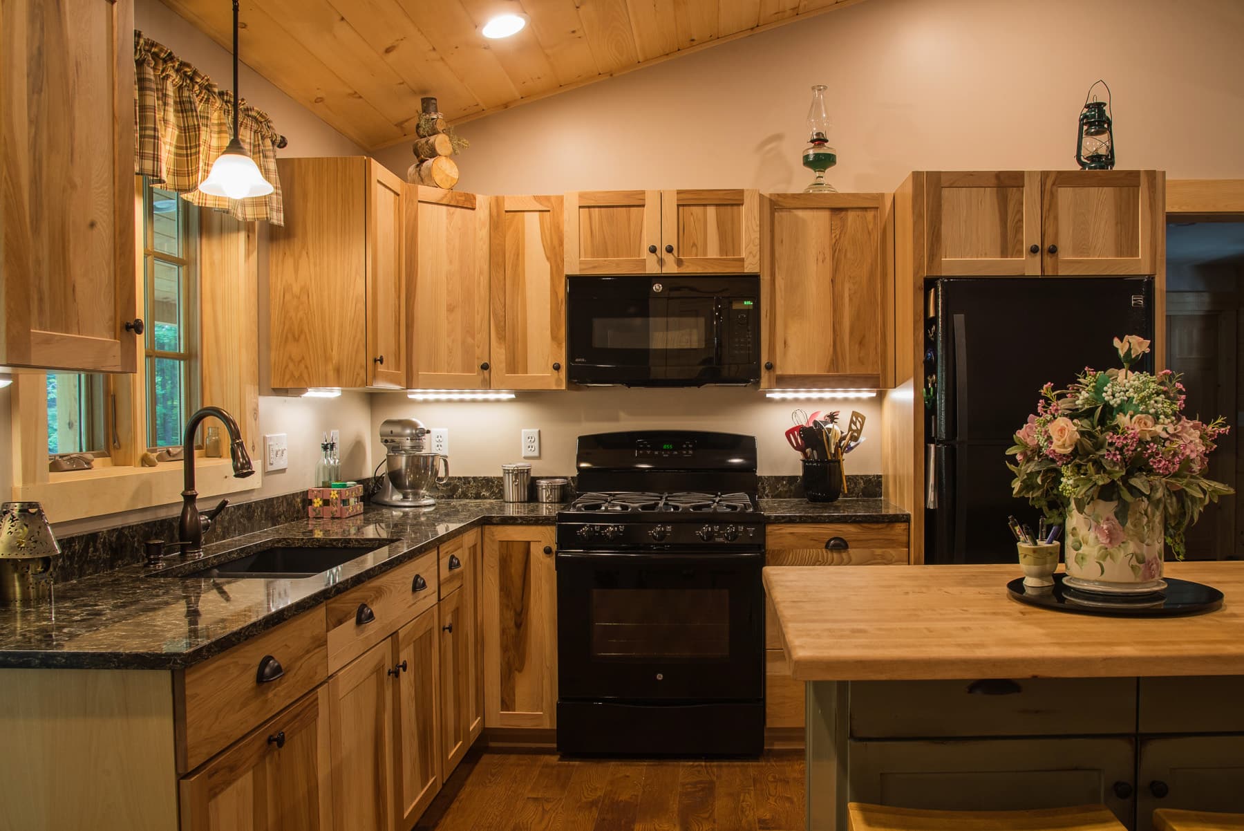 Natural wood kitchen cabinetry and granite counters in Nottingham, New Hampshire